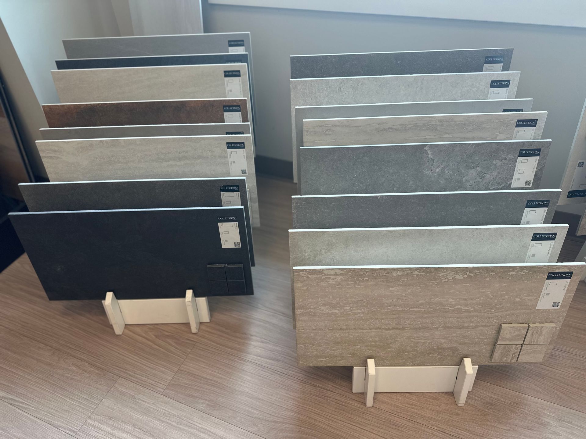 Tile sample boards standing on display stands in a flooring showroom